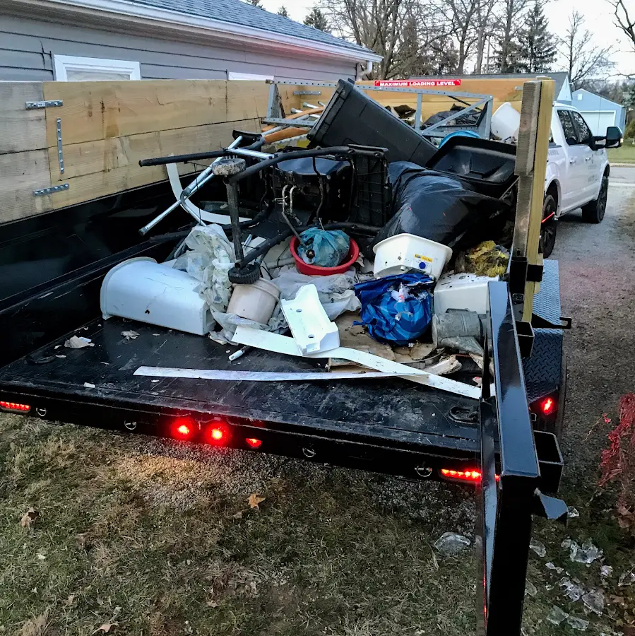 Roll-off dumpster delivered to a residential driveway in Great Neck Estates